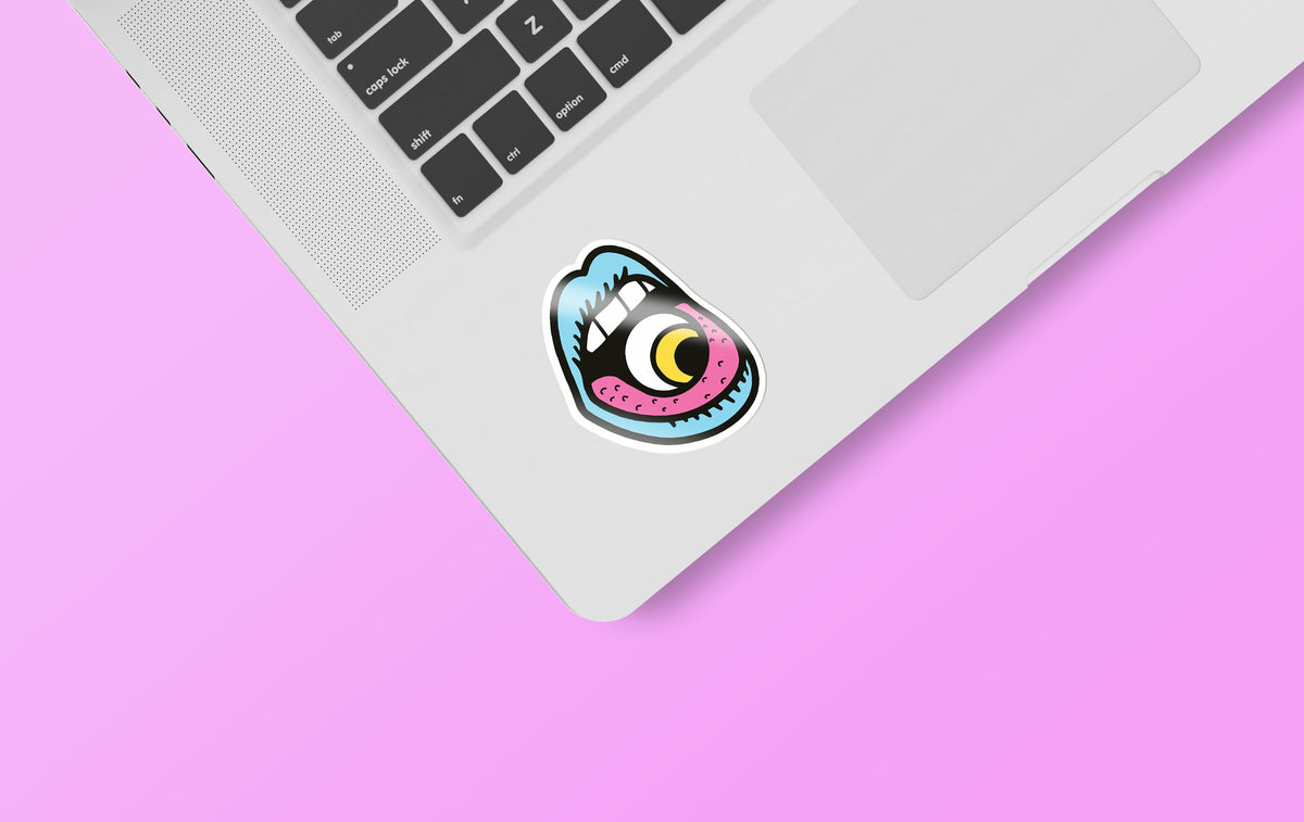 A KosmicSoul Eye In Mouth Sticker on a pink background.