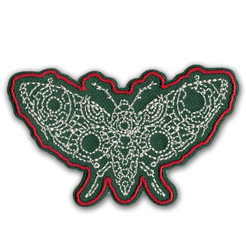 A green and red KosmicSoul Butterfly Moth Patch sewn on patch.