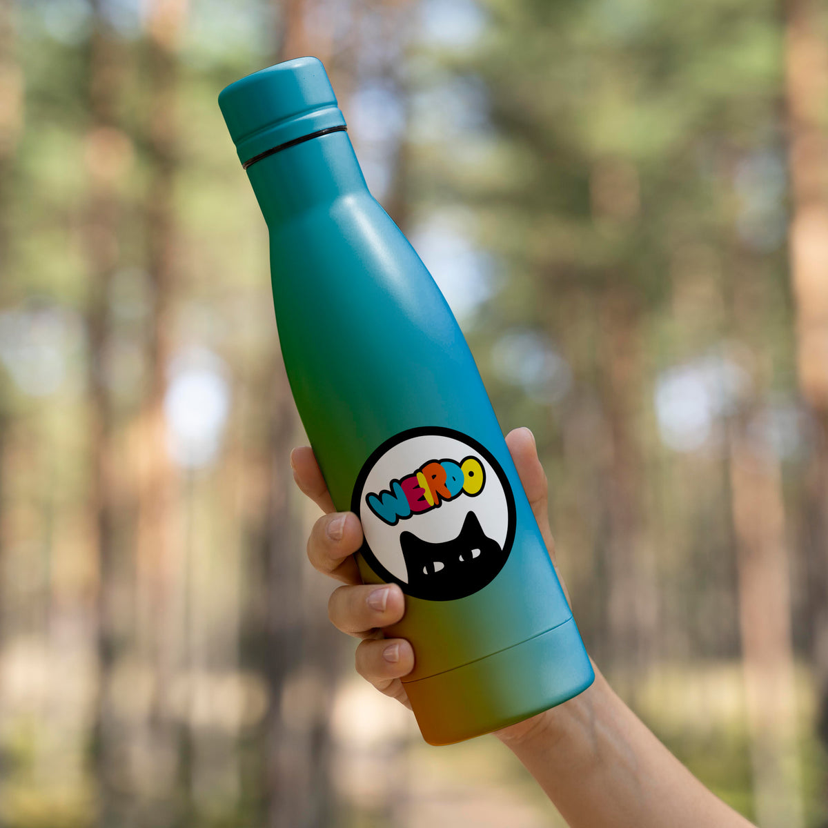 A person holding a Weirdo Sticker water bottle with a matte finish from KosmicSoul.