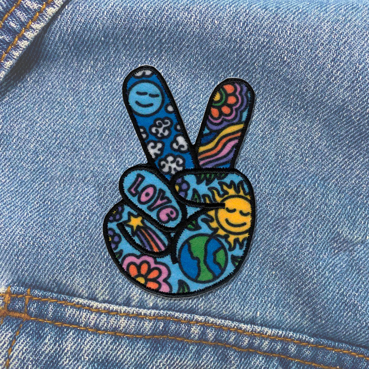 KosmicSoul Peace Sign Patch sewn on a denim jacket.